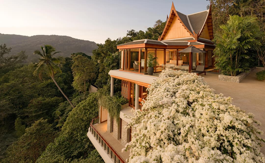 Seven-bedroom ocean villa with outdoor pool at Amanpuri, Thailand, surrounded by tropical hillside vegetation