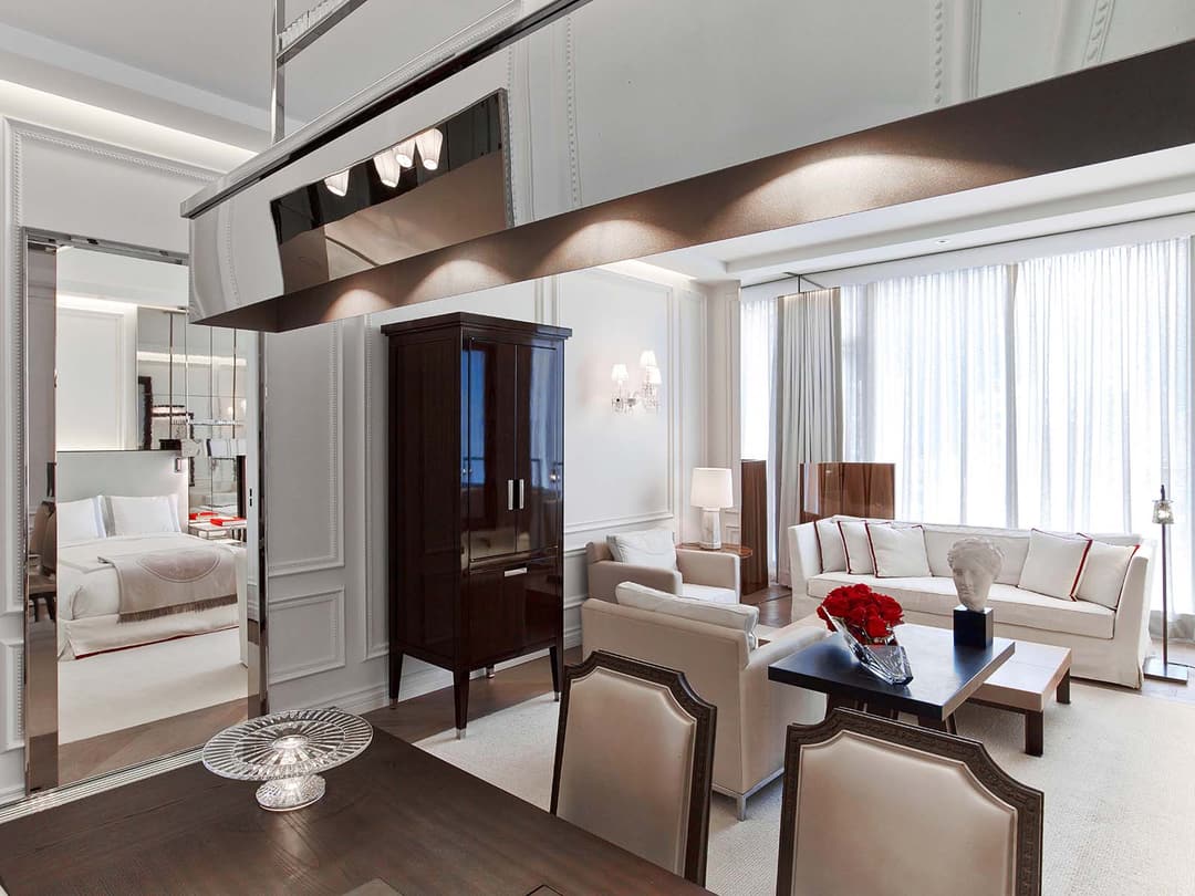 The dining table, living space and view of the room in the Harcourt One Bedroom Suite