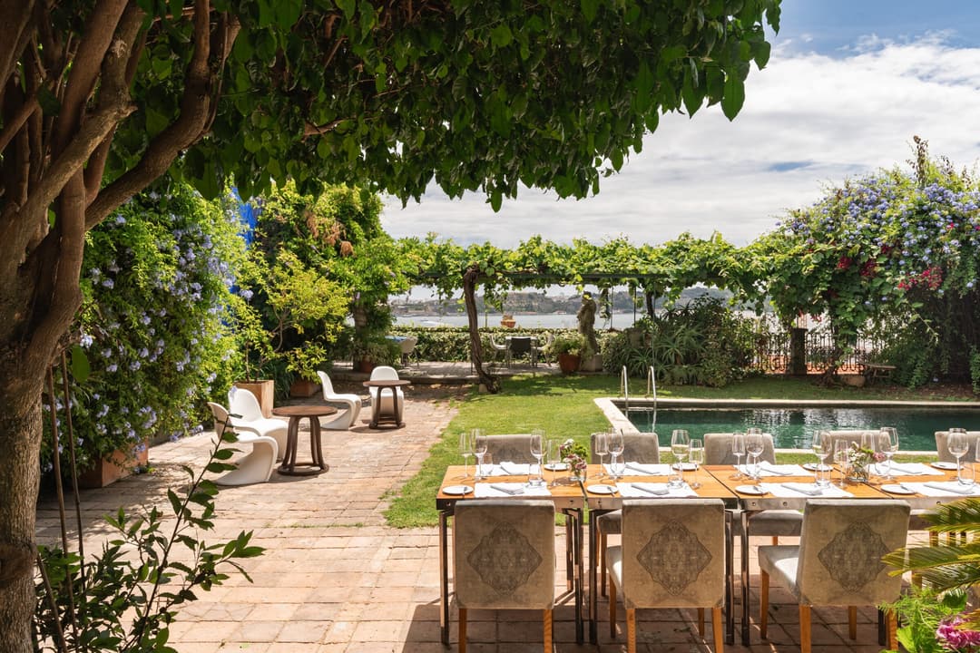 Shaded garden terrace configured for intimate private celebrations and dining at Verride Santa Catarina, Verride Palacio de Santa Catarina