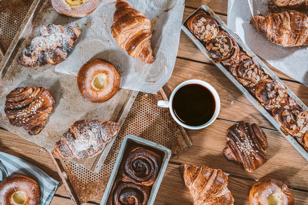 Pastries and coffee on baking trays at Hotel St George, Helsinki