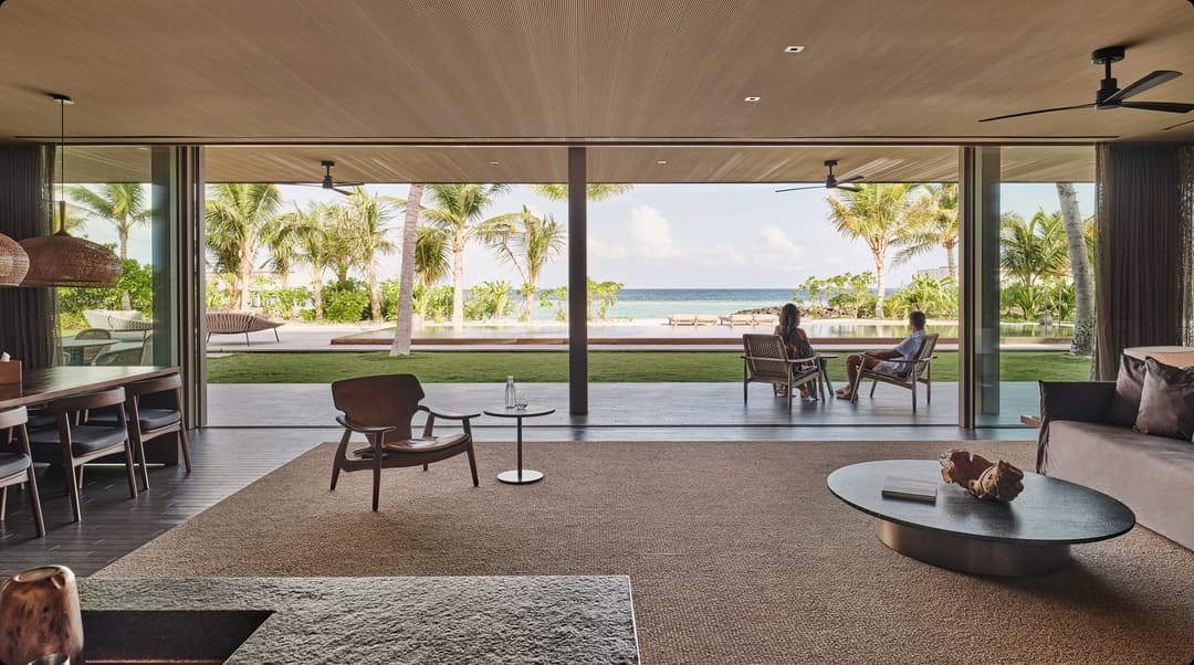 Contemporary living space in The Beach House, designed by Marcio Kogan, Patina Maldives, Fari Islands