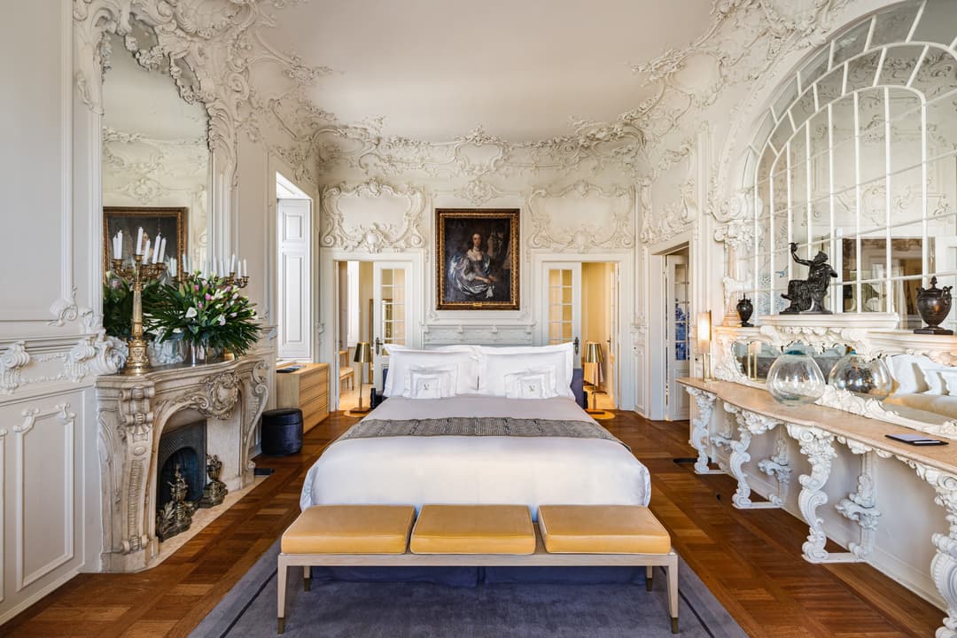 Spacious Queen Suite bedroom with sophisticated decor at Verride Santa Catarina, Verride Palacio de Santa Catarina