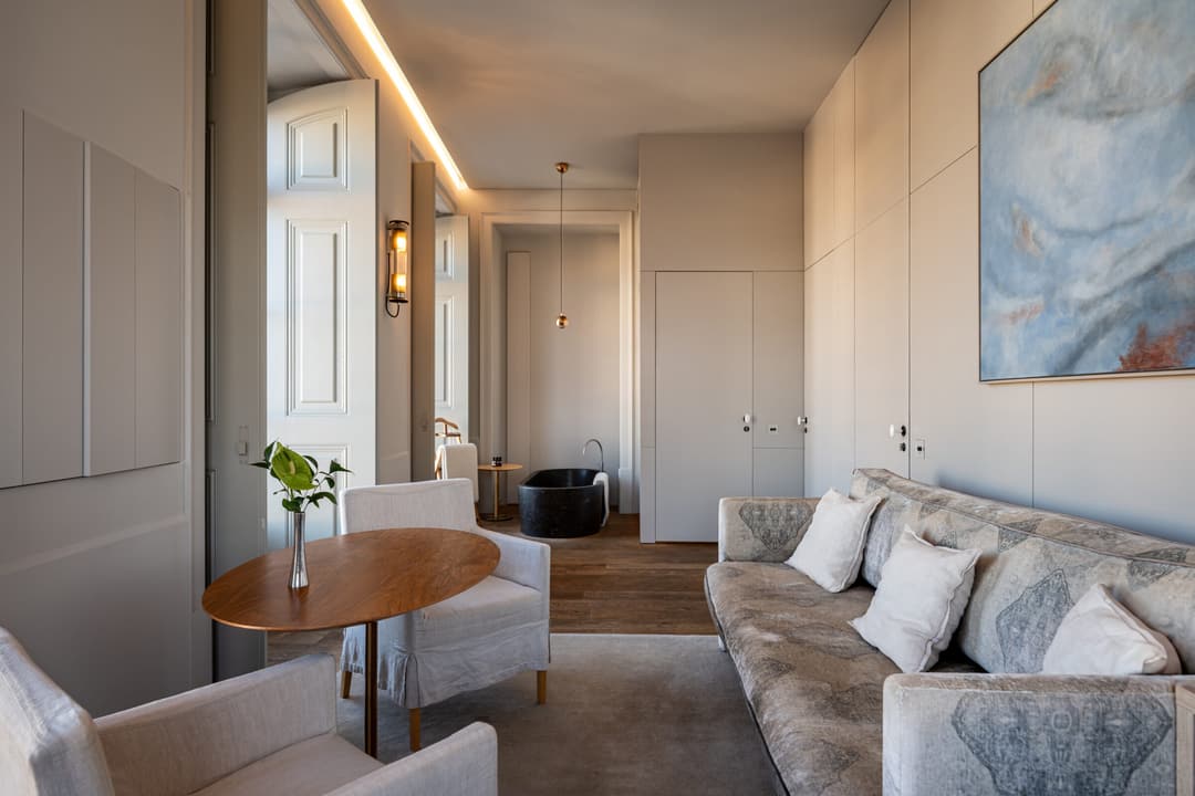 Private sitting room with elegant furniture inside the Premium Suite, Verride Palacio de Santa Catarina