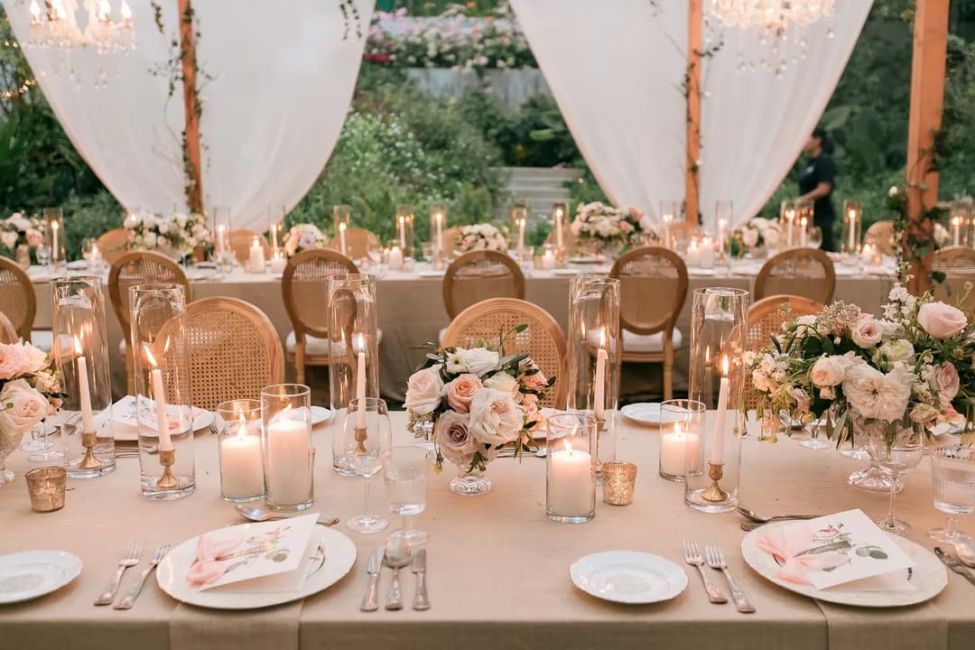 Outdoor Phuket wedding reception with draped white curtains and a chandelier, Rosewood Phuket