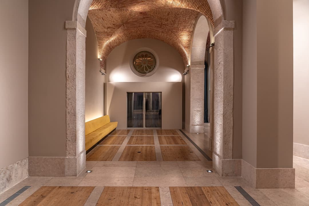 Unique event venue featuring historic stone arches and modern lighting at Verride Santa Catarina, Verride Palacio de Santa Catarina
