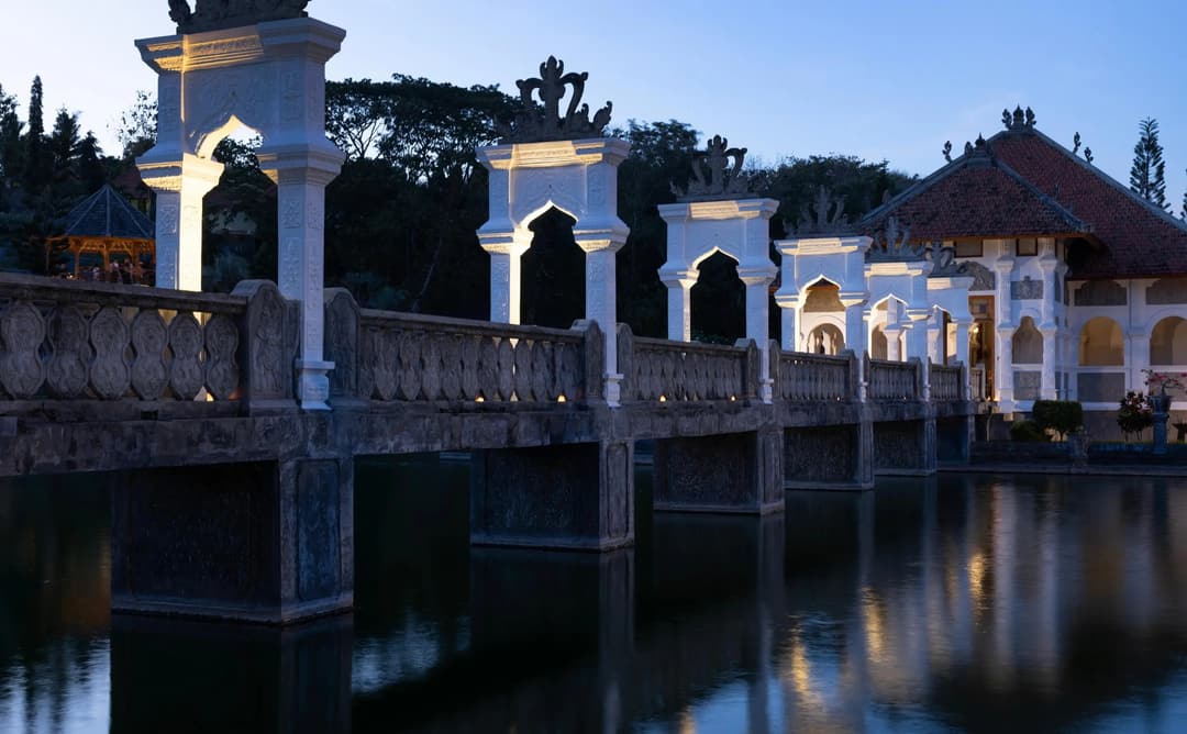 Amankila's royal dining pavilion reflected in still water at dusk, Karangasem, Bali, Manggis (East Bali)